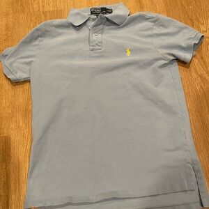 Light blue polo yellow horse